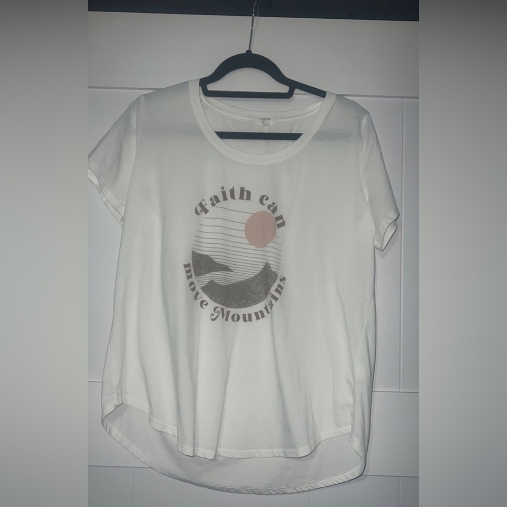 Maurice’s shirt “Faith Can Move Mountains”